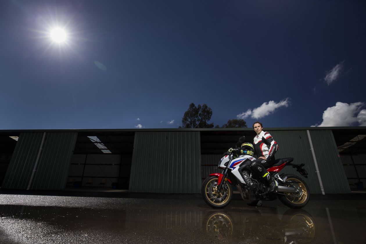 Chris Vermeulen riding his motorbike in the wet